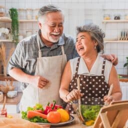 Happy couple preparing a holiday dinner.