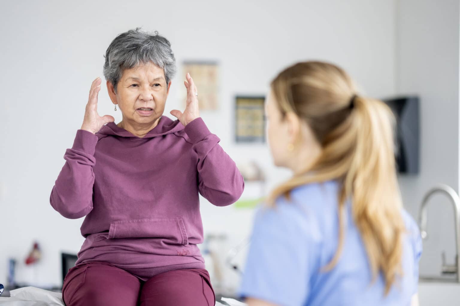 Woman speaking to her doctor about dizzy spells