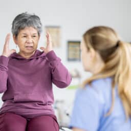Woman speaking to her doctor about dizzy spells