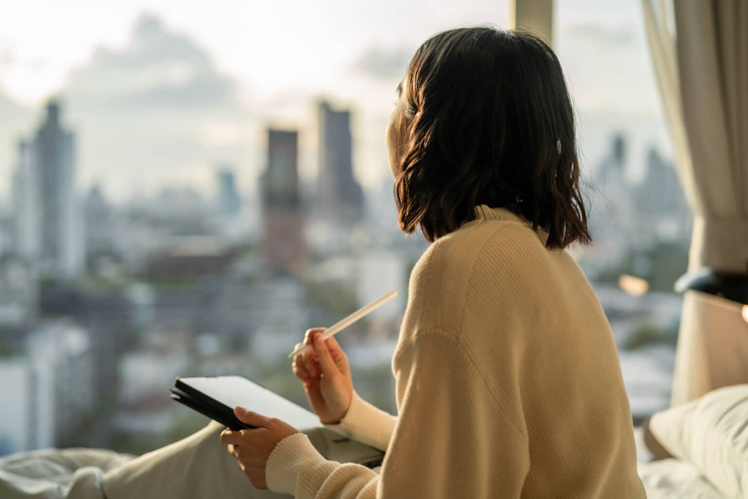 Woman writing her New Years' Resolutions
