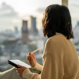 Woman writing her New Years' Resolutions