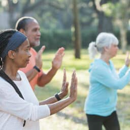 Outdoor tai chi class for seniors, improving balance and strength and building community.